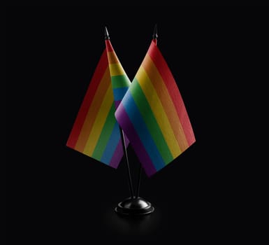 Small national flags of the lgbt on a black background.