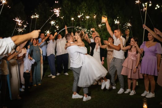 newlyweds at a wedding in the corridor of sparklers