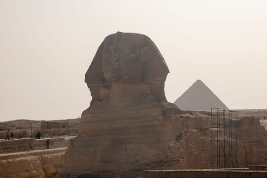 Giza, Egypt - April 13 2008: Sphinx and pyramids (Cheops and Khafre) in the archeological site of Giza. Egypt.