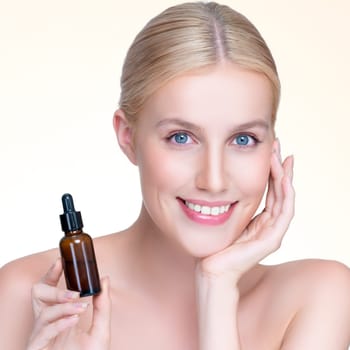 Closeup personable portrait of beautiful woman applying essential oil bottle for skincare product. Cannabis extracted CBD oil dropper for treatment and cannabinoids concept in isolated background.