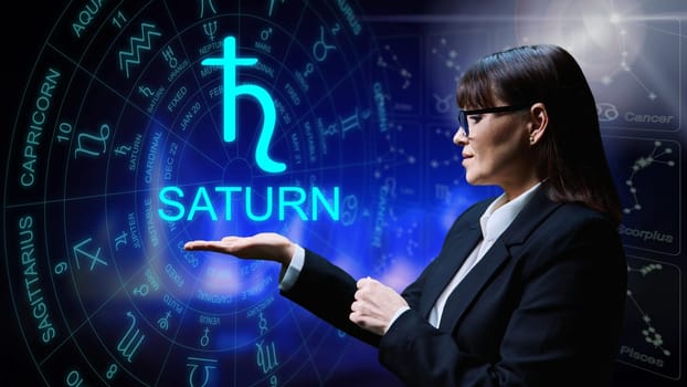 Astrological forecast, meaning, influence of planet Saturn. Serious woman on starry background showing Saturn sign symbol. Future forecast, astrology, horoscope, advice, universe, exoteric concept