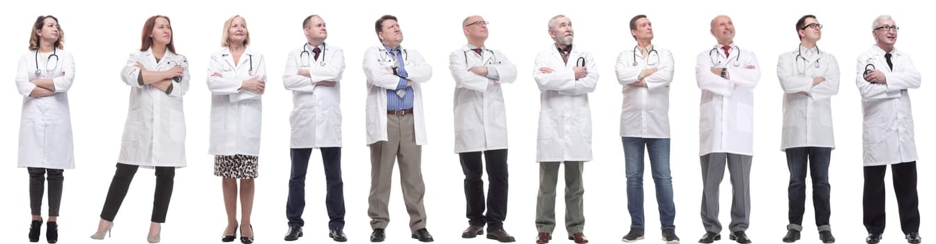 group of doctors standing in full length isolated on white background