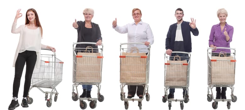 group of people with shopping cart showing thumbs up isolated on white background
