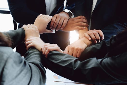 business group people showing unity with their hands together.