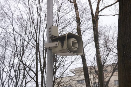 Speaker on a pole in the park close up