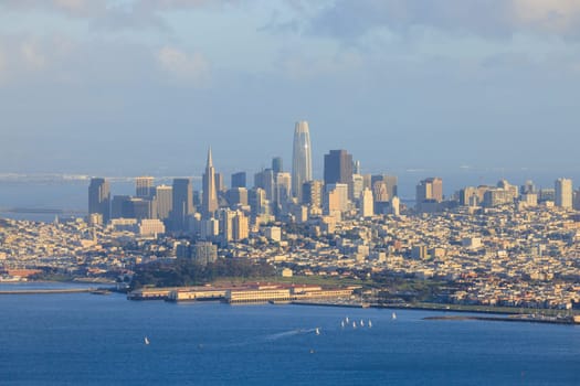 Modern skyscrapers on San Francisco skyline with sailboats off Marina. High quality photo