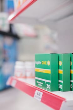 Empty pharmacy store filled with boxes of pharmaceutical products and supplements to help sick customers with disease. Drugstore shelves with packages of medication and pills bottles