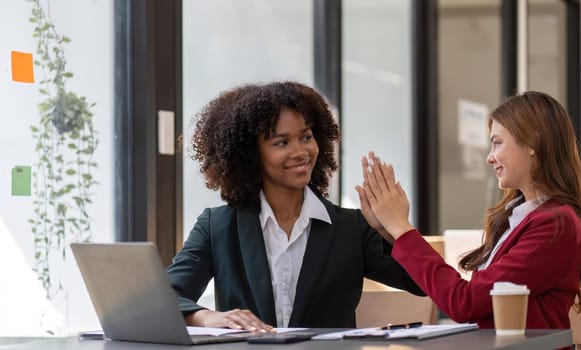 Happy smiling businessman feel happy work complete Teamwork success at work in the office concept.