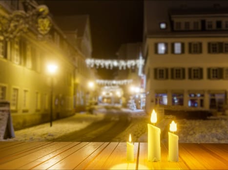 Candles in night in christmas mood on vintage wooden table and concrete block wall.3D Rendering.