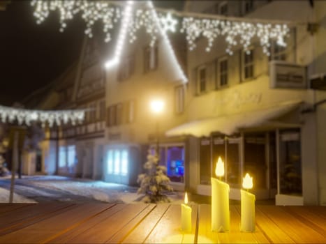 Candles in night in christmas mood on vintage wooden table and concrete block wall.3D Rendering.