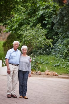 Forever and always. a happy senior couple standing outdoors while smiling at the camera