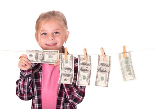 Girl hangs on the money on the rope