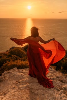 Woman in red dress, fashion model in evening dress, soaring in the street, sunset.