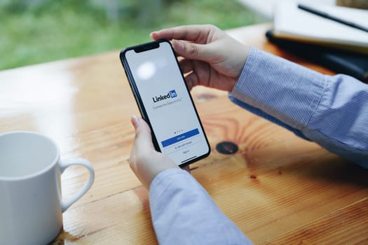 CHIANG MAI, THAILAND - JAN 30 2022 : Oneplus 6 with LinkedIn application on the screen. LinkedIn is a business-oriented social networking service.