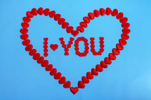 Heart love. Red heart shape from small hearts with the inscription I love you. Valentine's day lovers