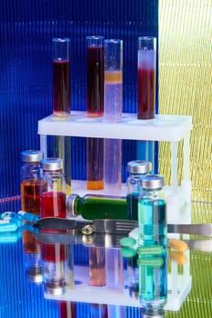 Lab test tubes and bottles with colored substance. Concept of laboratory medicine research.