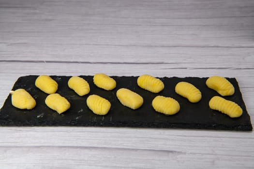 Pile of yellow eggs gnocchi Gnocci potato peru italian food, High quality photo