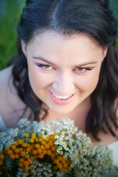 Portrait of Slavic plump chubby girl on the feast of Ivan Kupala with flowers on summer evening