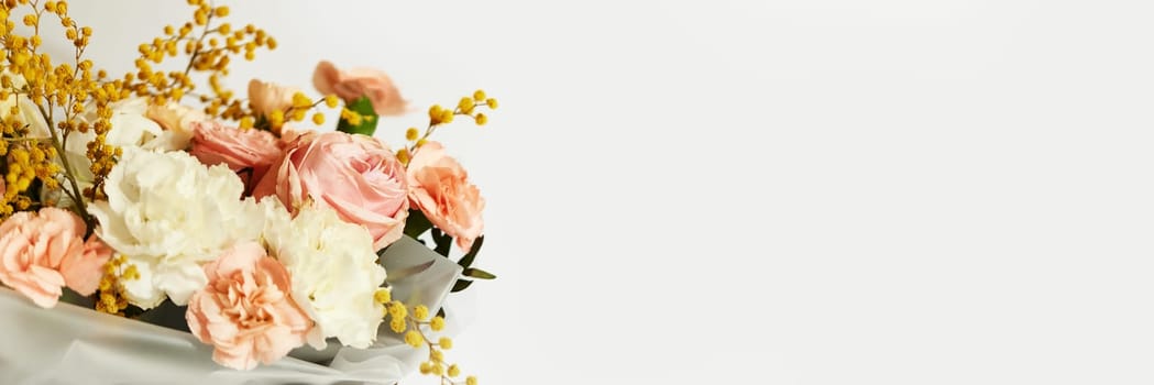 box with beautiful bouquet white and pink flowers on white background. Spring flowers. copy space