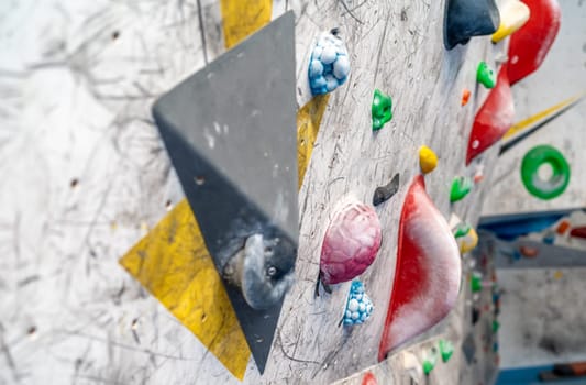 artificial climbing wall with colorful holds. High quality photo