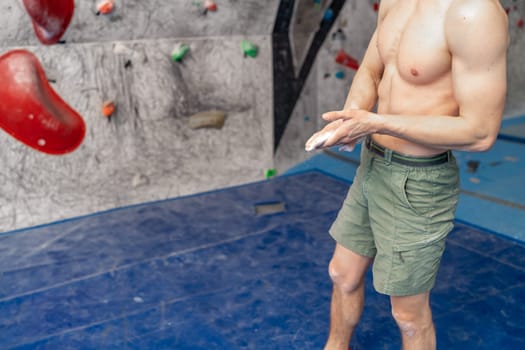 climbing magnesium on the hands of an athlete in a bouldering center. High quality photo