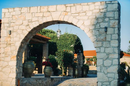 The entrance to the stone arch on the territory of the garden on the island of Zakynthos.Greece.