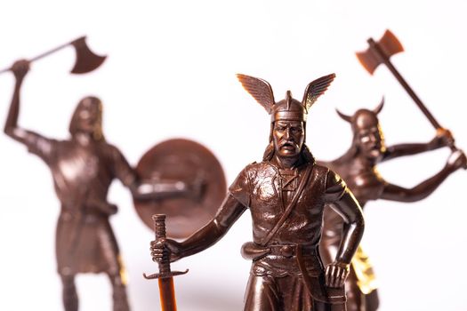 Vintage toy Brown Viking soldiers isolated on white background.