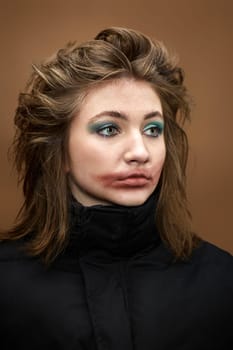 portrait of woman with smudged lipstick and stylish hairstyle in black jacket on beige background. defiant girl