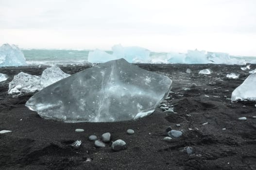 Closeup of crystal clear ice chunks at Diamond Beach in Fellsfjara, Jokulsarlon on Iceland