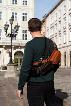 Three men's black leather hip crossbody belt bags. black, brown, foxy colours