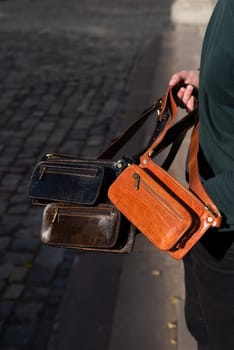 Three men's black leather hip crossbody belt bags. black, brown, foxy colours