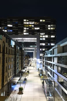 Zollhafen Street below and through the crane houses at night in Cologne, Germany