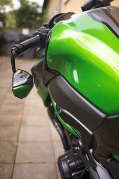 Close-up of the details of a neon green motorcycle in Germany