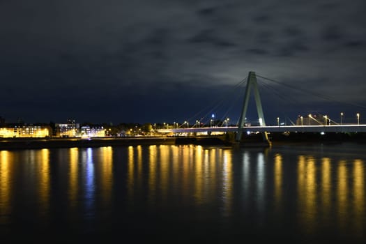 Severinsbrucke and the Rhine at night in Cologne, Germany