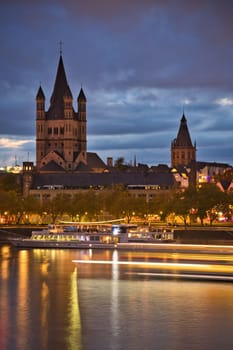 Church Great St. Martin by night with lots of lights in Cologne, Germany