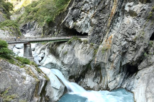 Beautiful view of the Ice blue river and the bridge over it in Tianxiang, Hualien, Taiwan