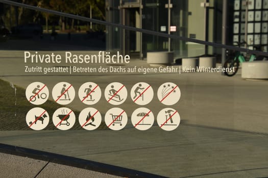 Prohibition sign for a private lawn with several prohibitions in Duesseldorf, Germany