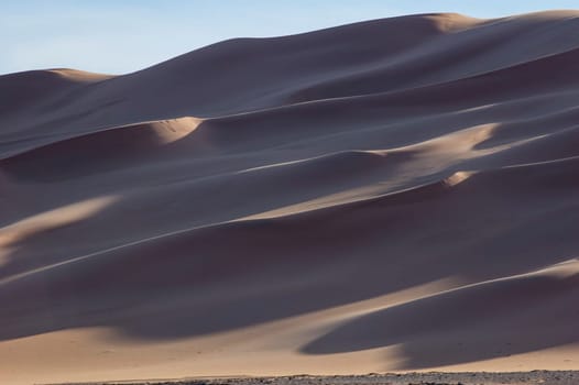 The orange dunes of the libyan Sahara desert



















