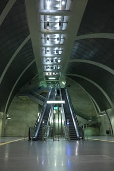 Futuristic subway station with guiding lines and an escalator near Heumarkt in Cologne, Germany