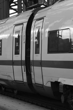 Grayscale closeup of the wagon and the door of a German express train in Cologne, Germany