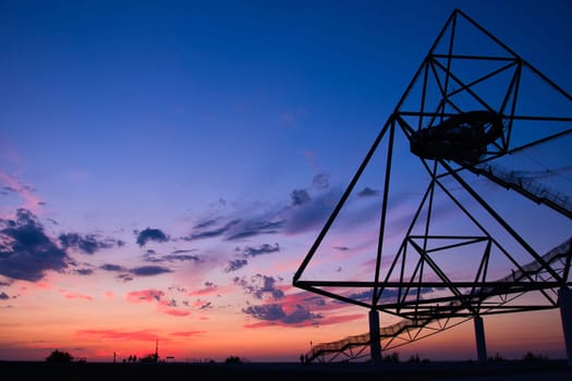 Viewing platform Tetraeder in Bottrop, Germany at sunset