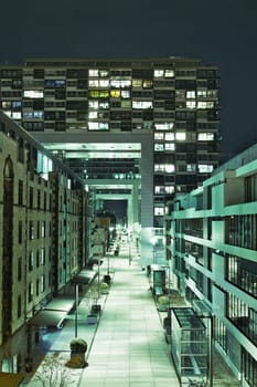 Zollhafen Street below and through the crane houses at night in Cologne, Germany