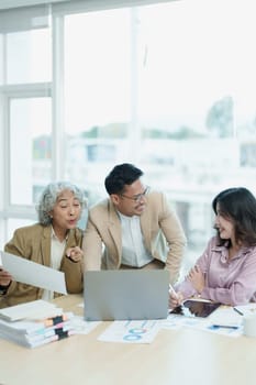 Asian entrepreneurs and business people meeting in a conference room in business planning, financial budget and investment risk assessment to analyze customer groups to increase company growth.