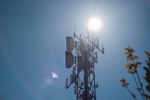 Telecommunication towers with wireless antennas against the sky. TV tower or radio tower.