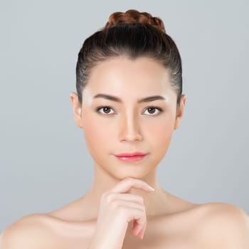 Glamorous woman portrait with perfect smooth pure clean skin with soft cosmetic makeup in isolated background. Beauty hand gesture with expressive facial expression for skincare product or spa ad.