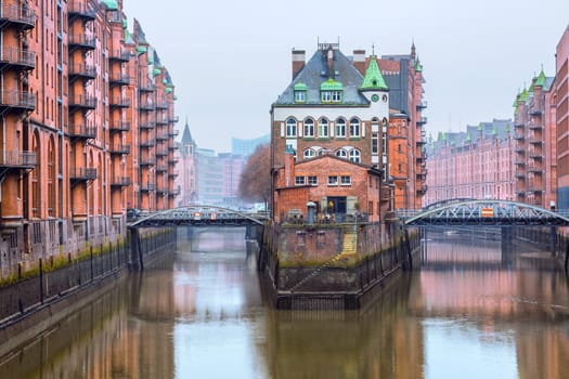 The old warehouse district (Speicherstadt) in Hamburg, Germany in winter. The largest warehouse district in the world is located in the port of Hamburg within the HafenCity quarter and is Unesco World Heritage.