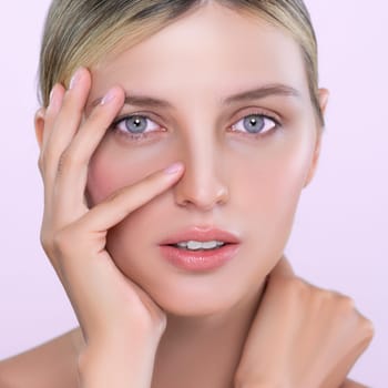 Closeup alluring beautiful woman with perfect smooth and clean skin portrait in isolated background. Beauty hand gesture with expressive facial expression for skincare treatment product or spa.