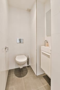 a modern bathroom with white walls and tile flooring, including a toilet in the corner of the shower stall