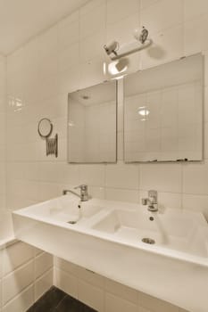 a white bathroom with two sinks and mirrors on the wall in front of the sink is an empty bathtub