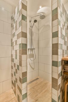 a bathroom with tiled walls and wood flooring on the shower wall, there is a wooden bench in the corner